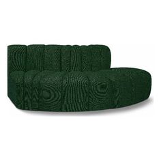 a green couch sitting on top of a white floor