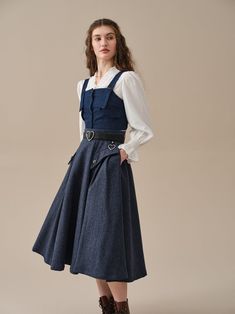 Winter Long Pleated Dress, Winter Dress With Long Pleated Skirt, Chic Flowy Wool Skirt, Flared Skirt Dresses For Work In Fall, Spring A-line Wool Skirt, Elegant Winter Dress With Flared Skirt, Long Lined Skirt Dress For Fall, Flowy Skirt Dress For Fall, Fall Pleated Skirt For Daywear