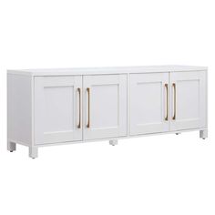 a white cabinet with gold handles and doors