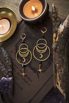 * Stunning statement Moon and Stars earrings which will give your outfit a mystical touch.  * These beautiful dangling earrings have a witchy, bohemian feel to them. * Stainless steel! * The total length of the earrings is approximately 10 cm (aprox 4 inches), hook included.  * They come in a pretty little pouch 🖤 *Matching necklace available: https://www.etsy.com/listing/1736069481/celestial-necklace-with-moon-and-star Celestial Whimsigoth, Celestial Goth, Black Flower Crown, Witchy Boho, Stars Earrings, Celestial Earrings, Moon And Star Earrings, Celestial Necklace, Witchy Jewelry