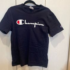 Nwot, Men’s Size S Champion Tee. Short Sleeve. White Champion Logo On Chest, Smaller Embroidered Logo On Left Arm. Classic Blue T-shirt With Logo Print, Classic Blue T-shirt With Letter Print, Classic Blue Tops With Letter Print, Champion Logo, Fancy Dresses, Blue White, Tee Shirts, Blue And White, Mens Shirts