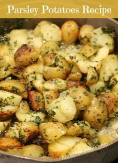 a pan filled with potatoes covered in parsley