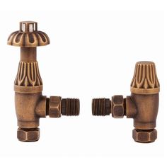 two bronze colored faucets on a white background