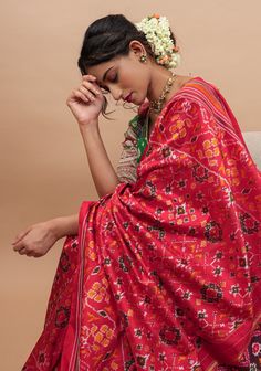 Ikkat Sarees are exquisite and for all the right reasons! This beautiful saree comes in a bold and beautiful red and has intricate Ikkat patterns woven all over the body! Set on pure silk and handwoven to grace, this saree is sure to make you mark your presence! SILK MARK CERTIFIED This saree is ready to wear with fall and pico done. Handmade silk tassels adorn the pallu and add more grace to it. An unstitched blouse fabric is included. *Note: There may be minor variations in the shade, the text Luxury Tussar Silk Saree For Navratri, Odisha Saree Silk, Red Paithani Silk Pre-draped Saree For Puja, Red Pre-draped Saree With Traditional Patterns For Navratri, Designer Red Paithani Silk Pre-draped Saree, Red Unstitched Pre-draped Saree For Diwali, Red Chanderi Pre-draped Saree With Dupatta, Red Pre-draped Saree With Pallu For Eid, Red Unstitched Anarkali Pre-draped Saree