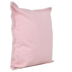 a pink pillow with ruffled edges on a white background