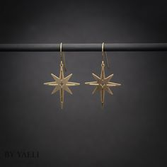 "You'll shine when you will wear this celestial dangle earrings. This north stars earrings is perfect to wear at work, holidays, and even for a party. ★Comes in our signature gift box, ready for gift giving. ★ Available in Gold [ gold-filled ear wires & gold plated brass ] ★ Earring size (star) 1.20\"x0.90\". Thanks for shopping at ByYaeli♥ All images, texts & products are property of ByYaeli ©2020" Celestial Star Charm Earrings For Everyday, Everyday Celestial Earrings With Star Charm, Everyday Celestial Star Earrings, Gold Star-shaped Celestial Earrings, Gold Celestial Star Earrings, Gold Starburst Celestial Earrings, Celestial Star Shaped Brass Jewelry, Celestial Star-shaped Brass Jewelry, Star Dangle Earrings