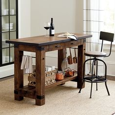 a kitchen table with two chairs next to it