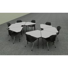 a group of tables and chairs sitting on top of a gray carpeted floor next to each other