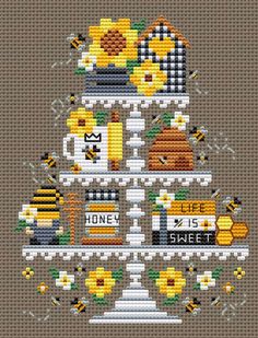 a cross stitch pattern with bees and honey on it's tiered cake stand