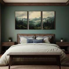 a bed with two paintings on the wall above it