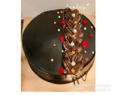 a birthday cake with chocolate frosting and decorations