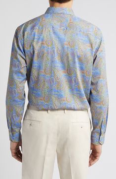 Pastel paisleys look graceful and subtly mod on a cotton sport shirt that's going to make a good impression wherever it's worn. Front button closure Spread collar Long sleeves with convertible, adjustable button cuffs Chest patch pocket 100% cotton Machine wash, dry flat Imported Classic Paisley Print Button-up Shirt, Fitted Collared Shirt With Paisley Print, Classic Shirt With Paisley Print And Spread Collar, Classic Blue Printed Tops, Blue Paisley Print Long Sleeve Shirt, Blue Cotton Tops With Paisley Print, Classic Long Sleeve Shirt With Paisley Print, Classic Summer Shirt With Paisley Print, Classic Long Sleeve Paisley Print Shirt