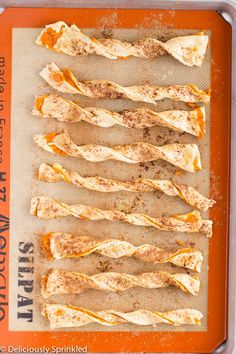 an orange tray filled with food on top of a table