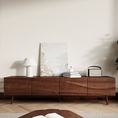 a living room scene with focus on the coffee table and sideboard in the foreground