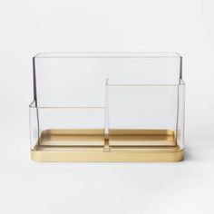 two clear and gold containers on a white background