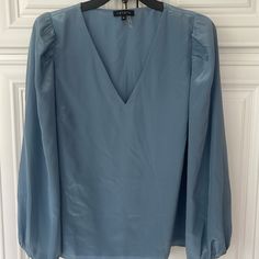 Preowned- In Like New Condition- Never Worn- Purchased Online From Nordstrom, Did Not Fit Me And Missed The Return Date. Slate Blue- Glossy/ Sheen Light And Airy Balloon-Style Sleeves Beautifully Frame This Stunning V-Neck Top From 1.State, A Versatile And Perfect Choice To Pair With Anything From Denim To A Skirt. Shell: Polyester; Lining: Polyester. Satin V-Neck Balloon Sleeves Blue Billowy Long Sleeve Blouse, Light Blue Buttoned V-neck Blouse, Blue Non-stretch Long Sleeve Blouse, Blue Rayon V-neck Blouse, Blue Rayon V-neck Top, Satin Blouse, Blouse Top, Polyester Satin, Balloon Sleeves