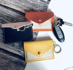 Small Card Wallet 📌Mini  Wallet Card Holder with Keychain Details : Item: Keychain Wallet Size: 3 x 3.75inches Color: Yellow, Black& Orange Material: Faux Leather  Compartments: Single  Slots and snap  💥Details ❤️This beautiful Single  Slots  Wallet with Keychain is one of a woman's best accessories as it is pretty functional and acts as a grab-and-go for school drop-off and pick-up, quick store shop, and  other errands. This card wallet allows your cards and keys to be in one place, which highly prevents misplacement at the store counters. ❤️You may also carry this keyring wallet attached, zipper, purse, bags, or loops by hand to switch up your style while secretly showing off to your friends. ❤️May be given to friends and families for Mother's Day, Thanksgiving, housewarming, moving, b Cardholder Wallet, Best Accessories, Orange Material, Keychain Wallet, Clip Wallet, Drop Off, Wallet Card, Mini Wallet, Money Clip Wallet