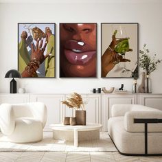 three paintings hanging on the wall in a living room