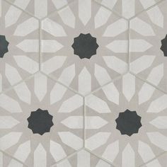 an artistic tile design with black and white shapes in the center, on a gray background