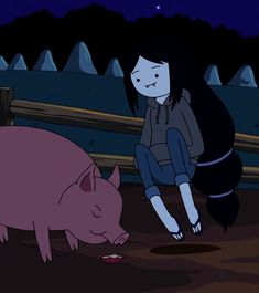 a woman kneeling down next to a pig