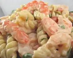 pasta salad with shrimp and carrots in a bowl