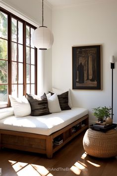 a living room filled with furniture and large windows