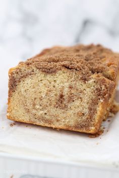 a loaf of cinnamon swirl bread sitting on top of a white plate