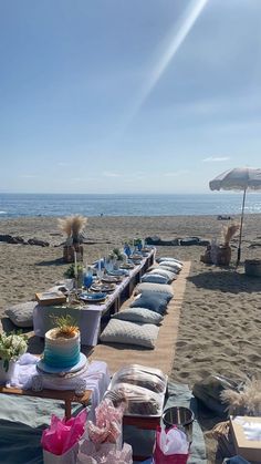 a table set up on the beach for a party