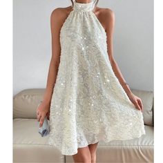 Cream Sequin Halter Mini Dress Xs S M L Xl, 100% Polyester, Ships In 7-8 Days White A-line Dress For Party Season, Spring Holiday A-line Dress, White Sleeveless Party Dress For Spring, White Glamorous Sleeveless Dress For Party, Glamorous White Sleeveless Dress For Party, Glamorous White Sleeveless Party Dress, White Sleeveless Spring Party Dress, Summer Party A-line Halter Dress, Sleeveless Sequin Halter Dress For Summer