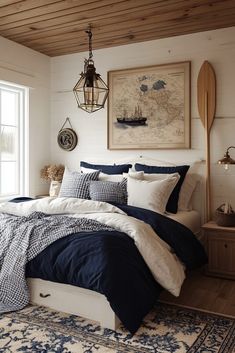 a bedroom with white walls and blue bedding