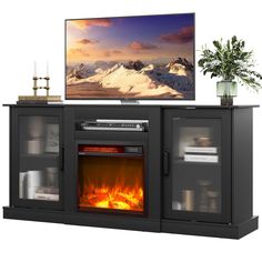 an entertainment center with a fireplace and television on it's stand in front of a white background