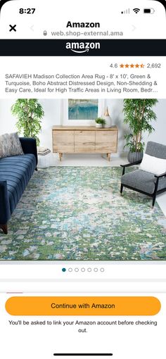 the amazon app shows an image of a living room with blue furniture and green rugs