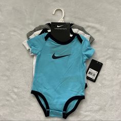 3 Pack Nike Baby Onesies Set. Condition: New With Tags. Baby Boy Nike, Tennis Whites, Baseball Hoodie, Tops Nike, Nike Baby, Nike Long Sleeve, Nike Pullover, Nike Tank Tops, Nikes Girl