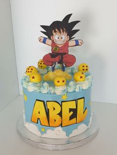 a birthday cake decorated with an image of gohan on top and the words abel