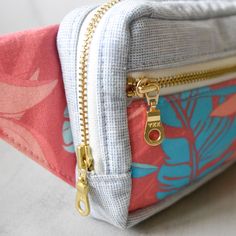 Beautiful pink and teal tropical florals and fauna decorate these fanny packs! As unique and pretty as a pink diamond. Ready to take on your next adventure or just a trip to the store, this simple, compact fanny pack will keep all your essentials close at hand. It's durable and fashionable, the perfect accessory for wherever your journeys may take you! No matter the destination, you're guaranteed to turn heads and look good doing it. Due to the handmade nature and pattern, no two fanny packs are Daily Use Pink Belt Bag With Zipper Pouch, Pink Belt Bag With Zipper For Daily Use, Pink Travel Belt Bag With Zipper Pouch, Pink Belt Bag With Zipper Pouch For Travel, Pink Pouch Belt Bag For Travel, Pink Zipper Pouch Belt Bag For Everyday Use, Tropical Florals, Pink Panther, Pink Panthers