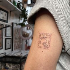 a person with a small tattoo on their arm