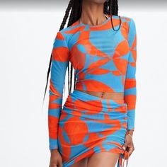 Great Deal!! Brand New - Never Worn, Still Have Tags!! 3 Pice Set Fabletics Low Back One Piece Swimsuit, New With Tags Still Attached And Has Panty Liner Inside, Floral Geo Blue And Orange. More Than Just A Swimsuit! Fabletics Floral Geo Swimsuit And Coverup The "Marie Mesh" Coverup Top Has Long Sleeves And Is An Easy Yet Cool Way To Coverup When On The Go. The Skirt Has Ties That Are Adjustable For The Length You Need Or Want. Swimsuit And Top Size Medium. Mini Mesh Skirt Size Small. Casual Fitted Orange Swimwear, Vibrant Fitted Blue Top, Vibrant Blue Fitted Top, Multicolor Printed Cover-up For Pool, Multicolor Short Sleeve Printed Cover-up, Multicolor V-neck Pool Cover-up, Multicolor Printed Short Sleeve Cover-up, Mesh Cover Up, Multicolor Print Beachwear Cover-up