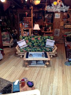 a living room filled with furniture and lots of wood flooring on top of a hard wood floor