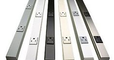 four different types of power strip with white and black electrical outlets on each one side