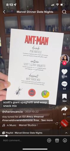 someone holding up a paper with an ant - man movie on it in their hand