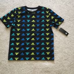 Nwt. Adidas Crew Neck Tee With All Over Logo Print A-798 Adidas Multicolor Graphic Print T-shirt, Sporty Multicolor Adidas Tops, Adidas Sporty Multicolor Tops, Adidas Multicolor Crew Neck T-shirt, Adidas Multicolor Short Sleeve Tops, Adidas Multicolor Graphic Print Tops, Adidas Camo, Adidas Tee, Adidas Kids