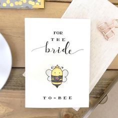 a card that says for the bride to be with a bee on it next to a plate