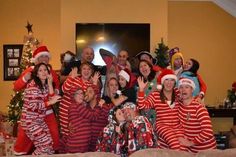 a group of people dressed up in christmas pajamas