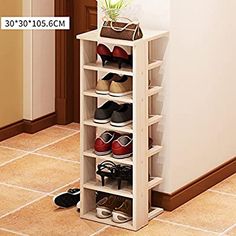 there is a shoe rack with many pairs of shoes on it