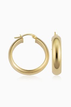 Radiant. Bold. Timeless. Our High Society Large Hoops are the statement earrings every fine jewelry collection needs. The wide, flattened solid gold tubes give them a classic, vintage feel, while the curved design creates a dome effect for maximum shine. Metal: 14 Karat Yellow Gold Dimensions: 6mm Width, 20mm Inner Diameter Construction: Solid Gold Tubing, Latch Closure Weight: 3 Grams Origin: Crafted in Arezzo, Italy Classic Hallmarked Luxury Earrings, Classic Gold-tone Tarnish Resistant Hoop Earrings, Classic Earrings With Polished Finish, Gold Hoop Earrings With Shiny Finish For Formal Occasions, Classic Polished Yellow Gold Earrings, Formal Gold Hoop Earrings With Shiny Finish, Classic Yellow Gold Polished Earrings, Classic Polished Finish Yellow Gold Earrings, Classic 14k Gold Earrings With Shiny Finish