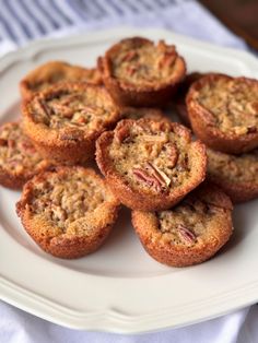 a white plate topped with muffins on top of a table