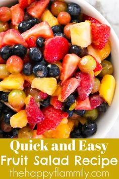 a white bowl filled with fruit salad on top of a table