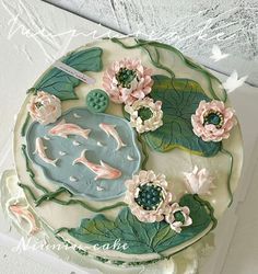 there is a cake decorated with flowers and leaves