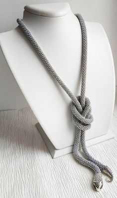 A handmade silver snake necklace from high-quality seed beads, cotton yarn with a snake head and tail clasps (jewelry hypoallergenic aluminum) is very flexible and comfortable to wear. * MEASUREMENTS: Necklace Length on photo: 40 inches (100 cm). Custom length available! Custom colors available! * This snake necklace could be lovely accessorize for your look every day, or special evening. This beaded necklace also is a perfect accessory, which can be worn formally or casually to add style to you Unique Handmade Silver Lariat Necklace, Adjustable Silver Beaded Lariat Necklaces, Adjustable Silver Lariat Beaded Necklaces, Handmade Silver Long Lariat Necklace, Handmade Silver Long Beaded Necklace, Adjustable Gray Necklace With Silver Beads, Unique Silver Long Beaded Necklace, Silver Snake Necklace, Serpent Necklace