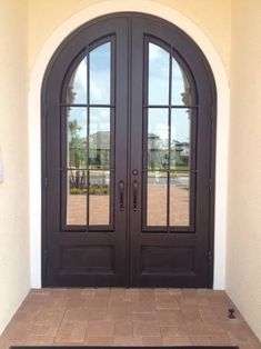 two double doors with sidelights and brick walkway